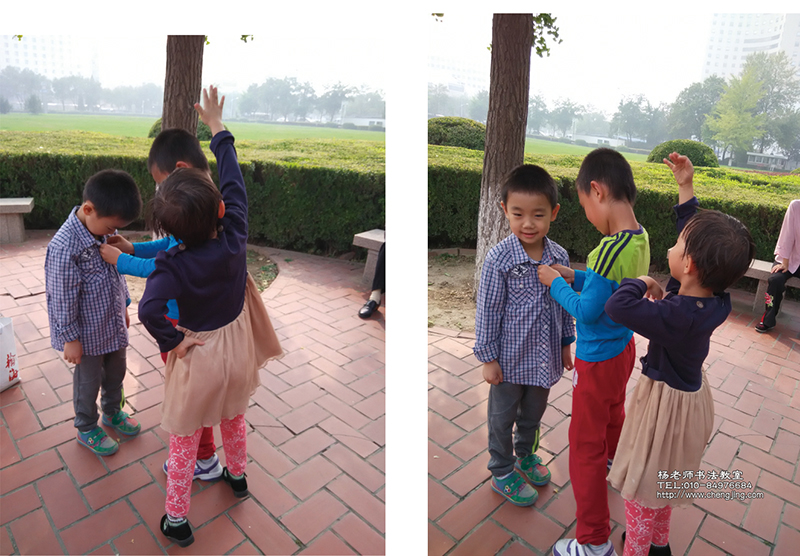 學(xué)長(zhǎng)幫助學(xué)弟系紐扣，忙得滿頭大汗，旁邊熱心的同學(xué)趕緊用小手當(dāng)扇子來為學(xué)長(zhǎng)送涼風(fēng)，同學(xué)們彼此親如兄妹。《弟子規(guī)》兄友弟恭，落實(shí)的真好